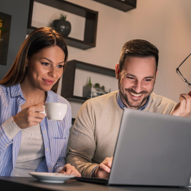 Happy Couple On Laptop.